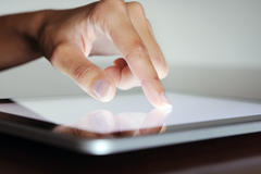 finger on tablet